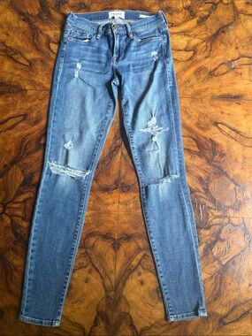 Frame Denim Skinny Jeans in Faded Blue with Distressing